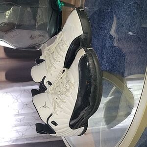 Men's black and white size 12 Jordan Retro 12s sneakers